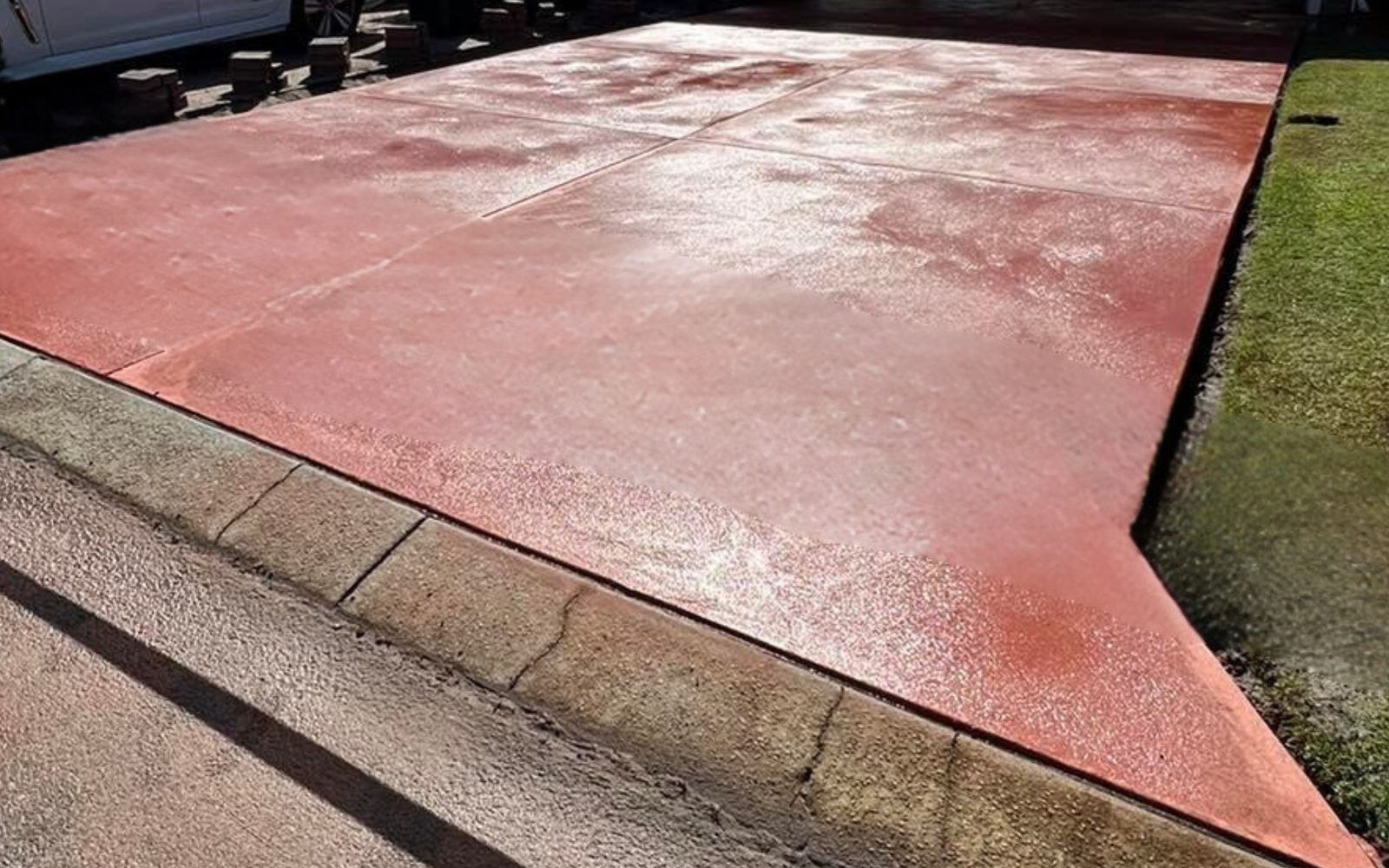 Red coloured concrete driveway in Notting Hill